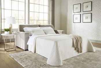 Sofa sleeper with bed extended and white bedding set, plus sofa throw pillows