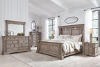 Panel bedroom set in gray wood: bed with posts, dresser, and nightstands