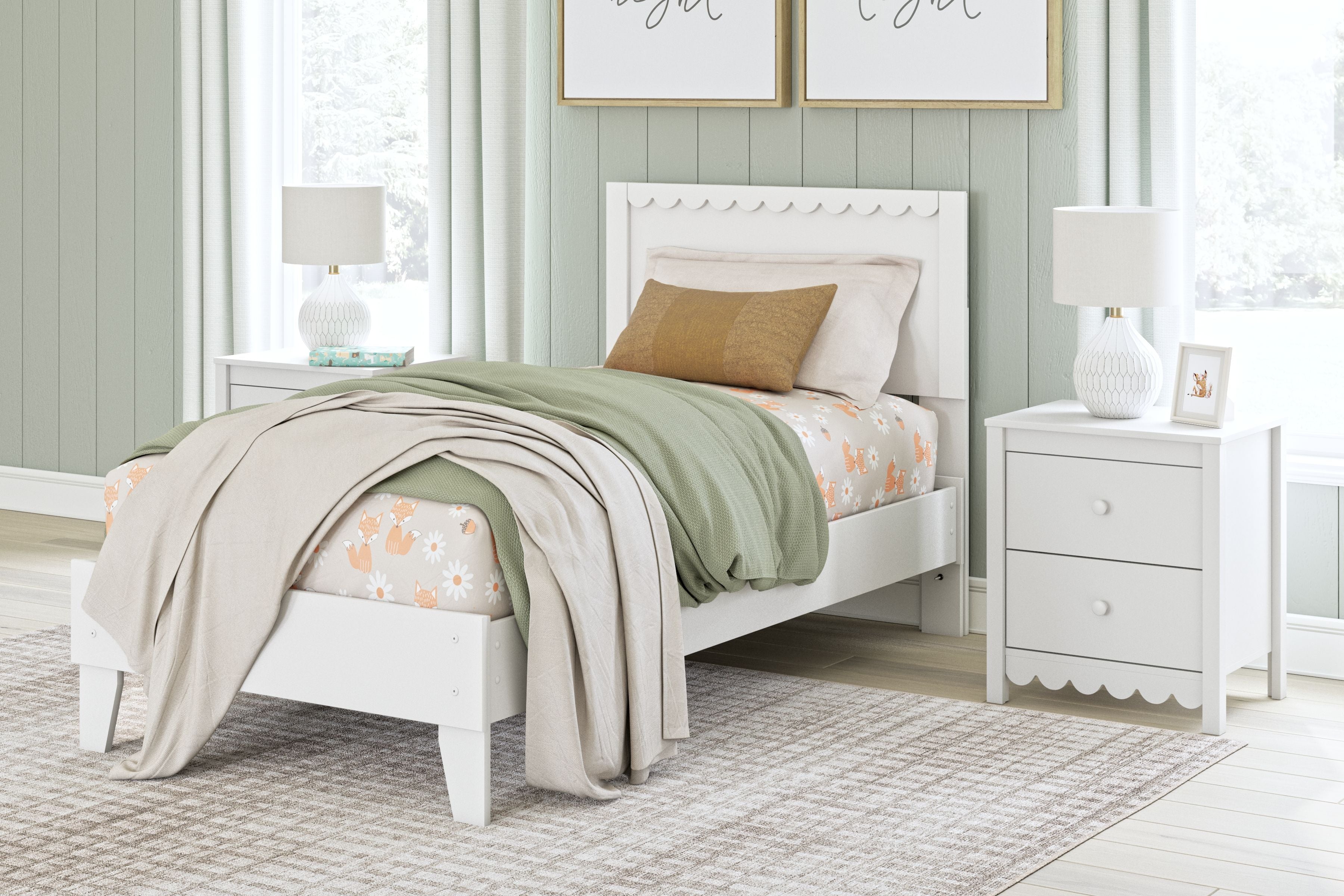 White panel platform bed with scalloped headboard, layered bedding and decorative pillows