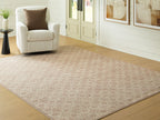 Area rug with beige background and subtle red geometric motif, flat woven texture
