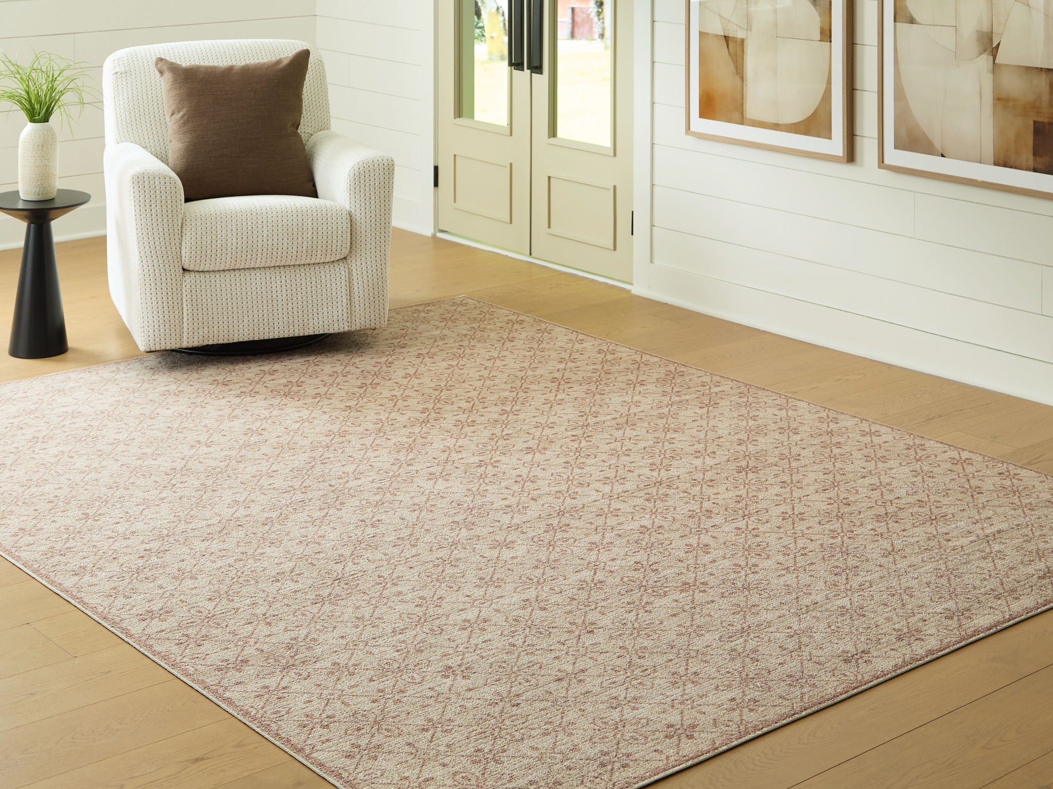 Area rug with beige background and subtle red geometric motif, flat woven texture