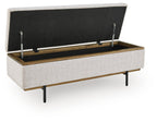 Stone storage bench with open lid, black underside, interior storage compartment visible