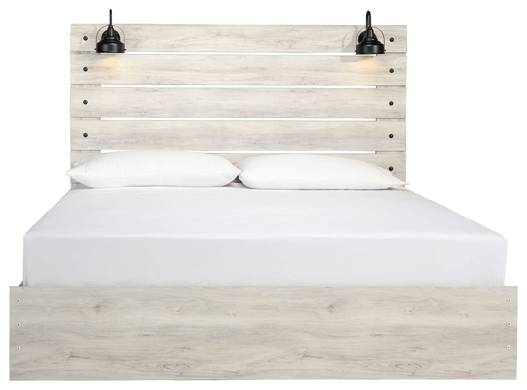 Light beige panel bed with slatted headboard, white mattress, and two black knob accents