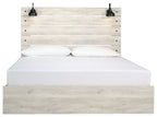 Light beige panel bed with slatted headboard, white mattress, and two black knob accents