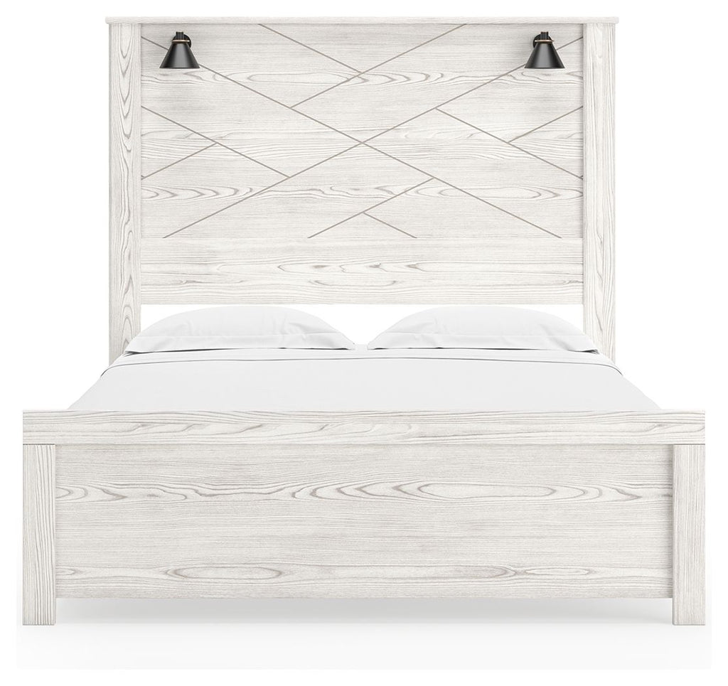 White panel bed with two black sconces, vertical slat headboard and white bedding