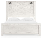 White panel bed with two black sconces, vertical slat headboard and white bedding