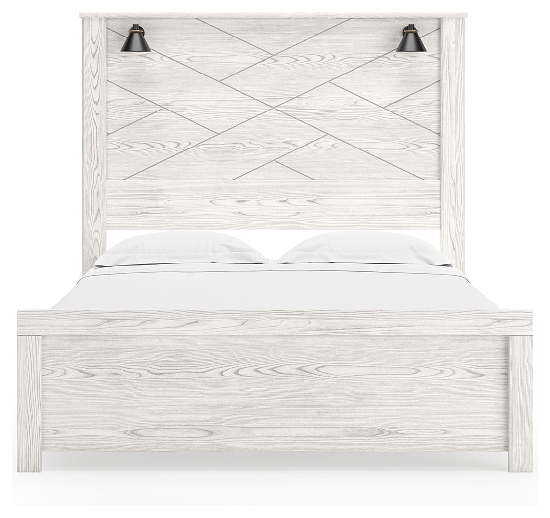 White panel bed with two black sconces, vertical slat headboard and white bedding
