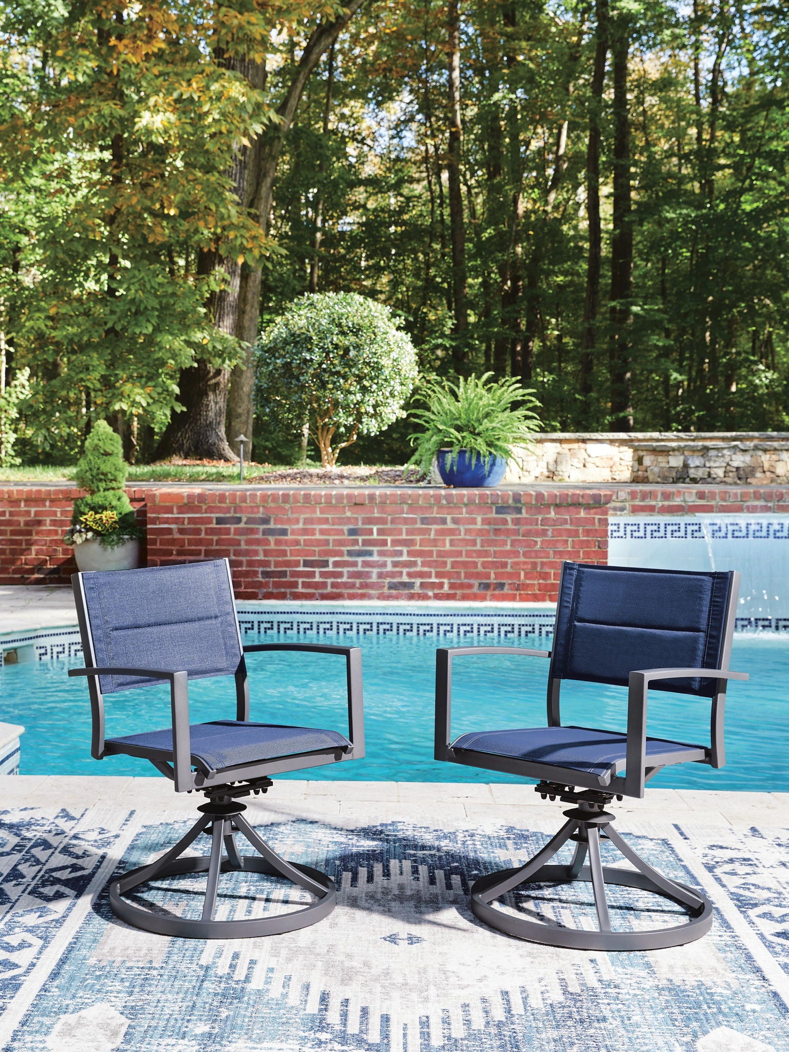 Set of 2 blue sling swivel chairs on gray circular swivel bases