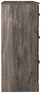 Gray dresser side panel with dark recessed hardware along the edge