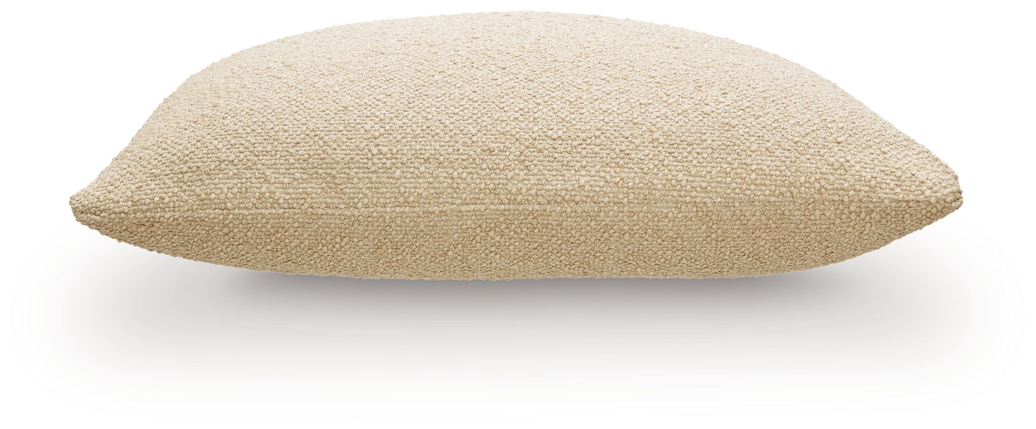 Beige lumbar pillow with textured fabric, side view