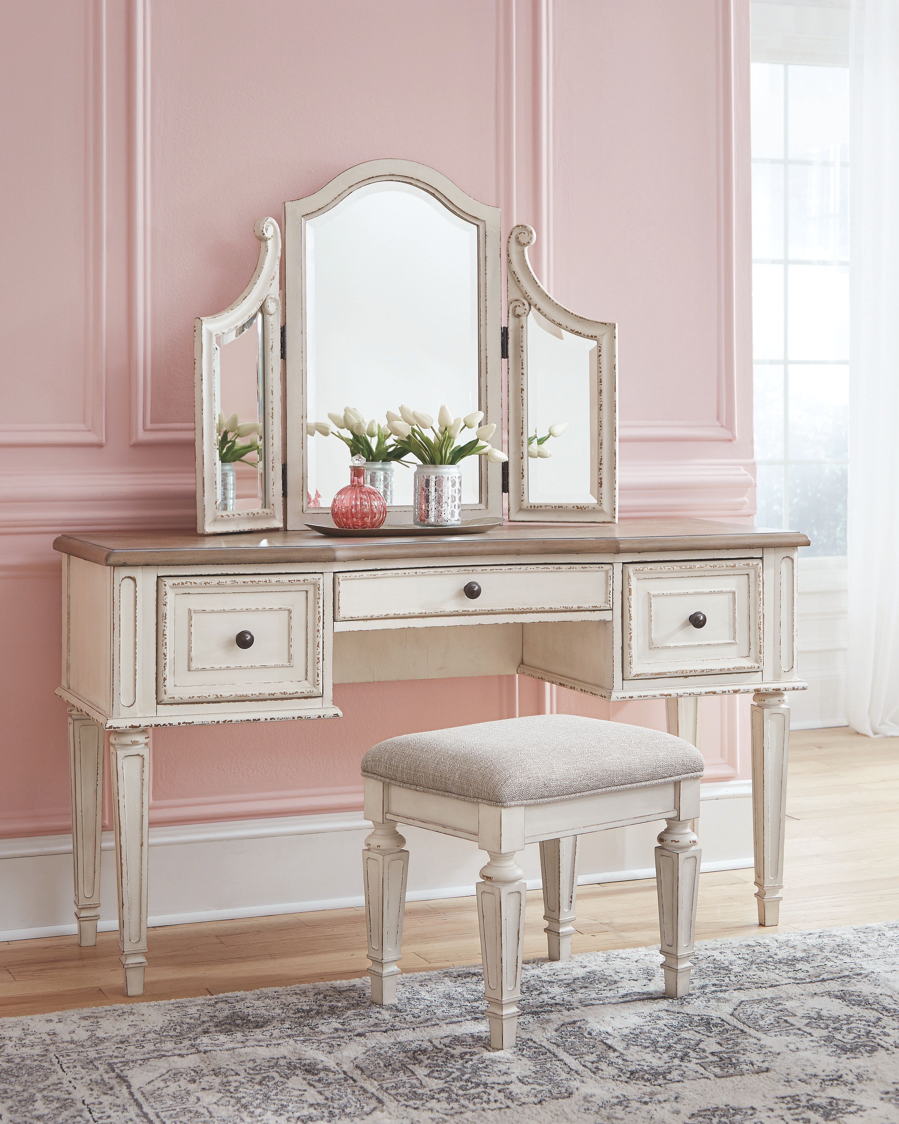 Vanity desk with arched mirror, side drawers, and beige upholstered stool