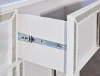 White dresser interior with metal rail and push-catch hardware