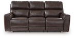 Three-seat power recline sofa with adjustable headrests in dark brown leather