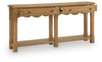 Light brown console sofa table with scalloped apron, drawers, and two open shelves