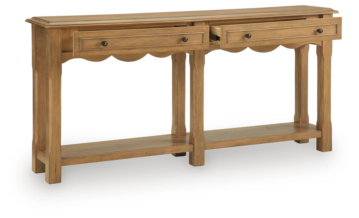 Light brown console sofa table with scalloped apron, drawers, and two open shelves