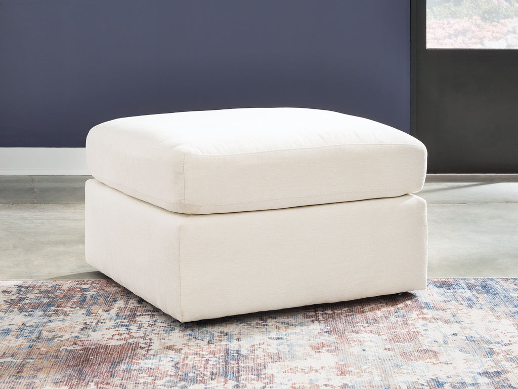 White upholstered accent ottoman with thick square arms and cushioned seat