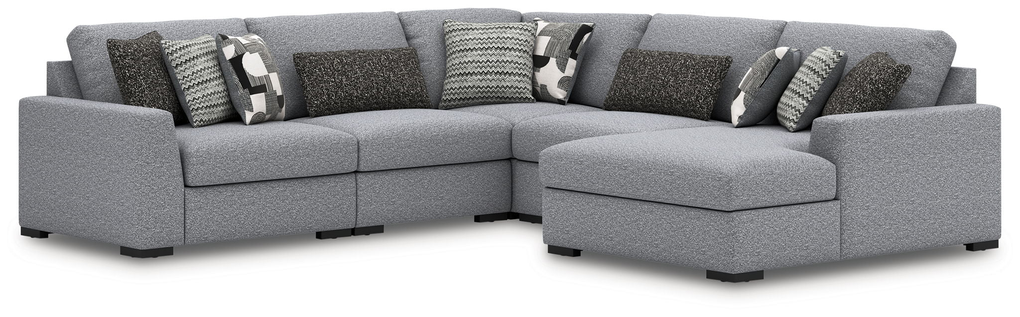 Gray fabric sectional sofa with chaise ottoman and patterned throw pillows