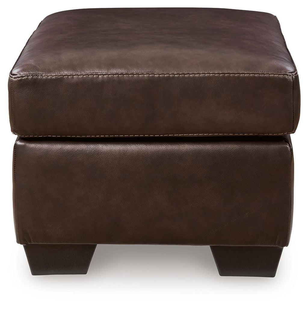 Dark brown upholstered ottoman with stitched seams and square block legs