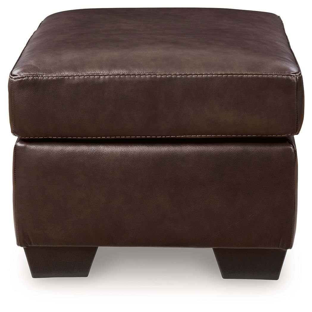 Dark brown upholstered ottoman with stitched seams and square block legs