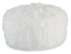 White round ottoman with fluffy shaggy faux fur upholstery