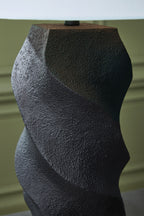 Close-up of black textured sculpted poly lamp base