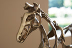 antique gold horse sculpture head and neck detail on dark base