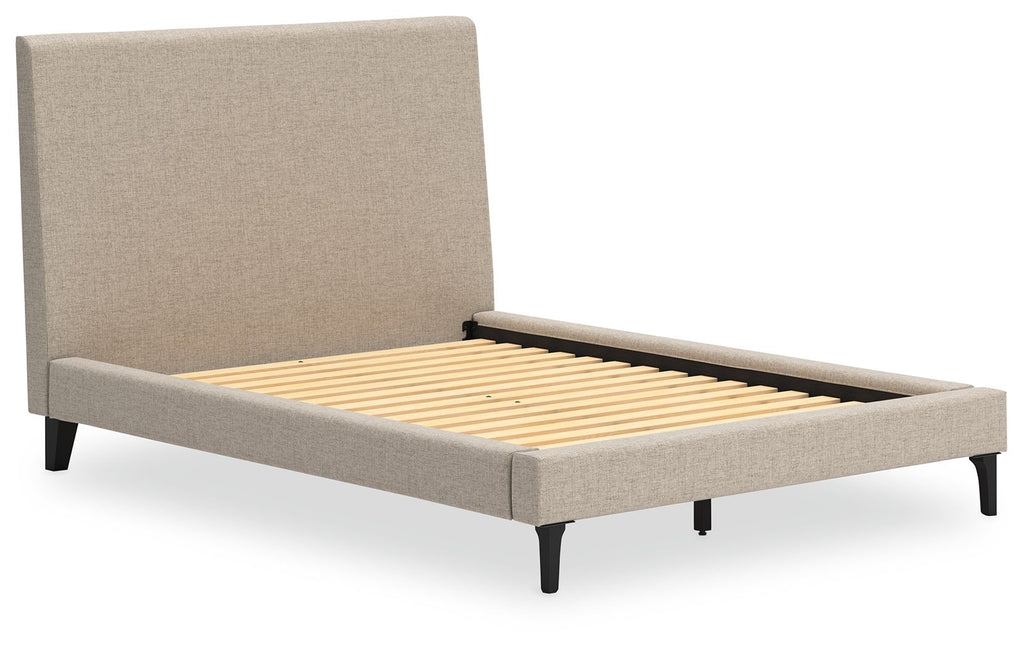 Gray upholstered bed with tall headboard, open roll-slat platform, tapered legs