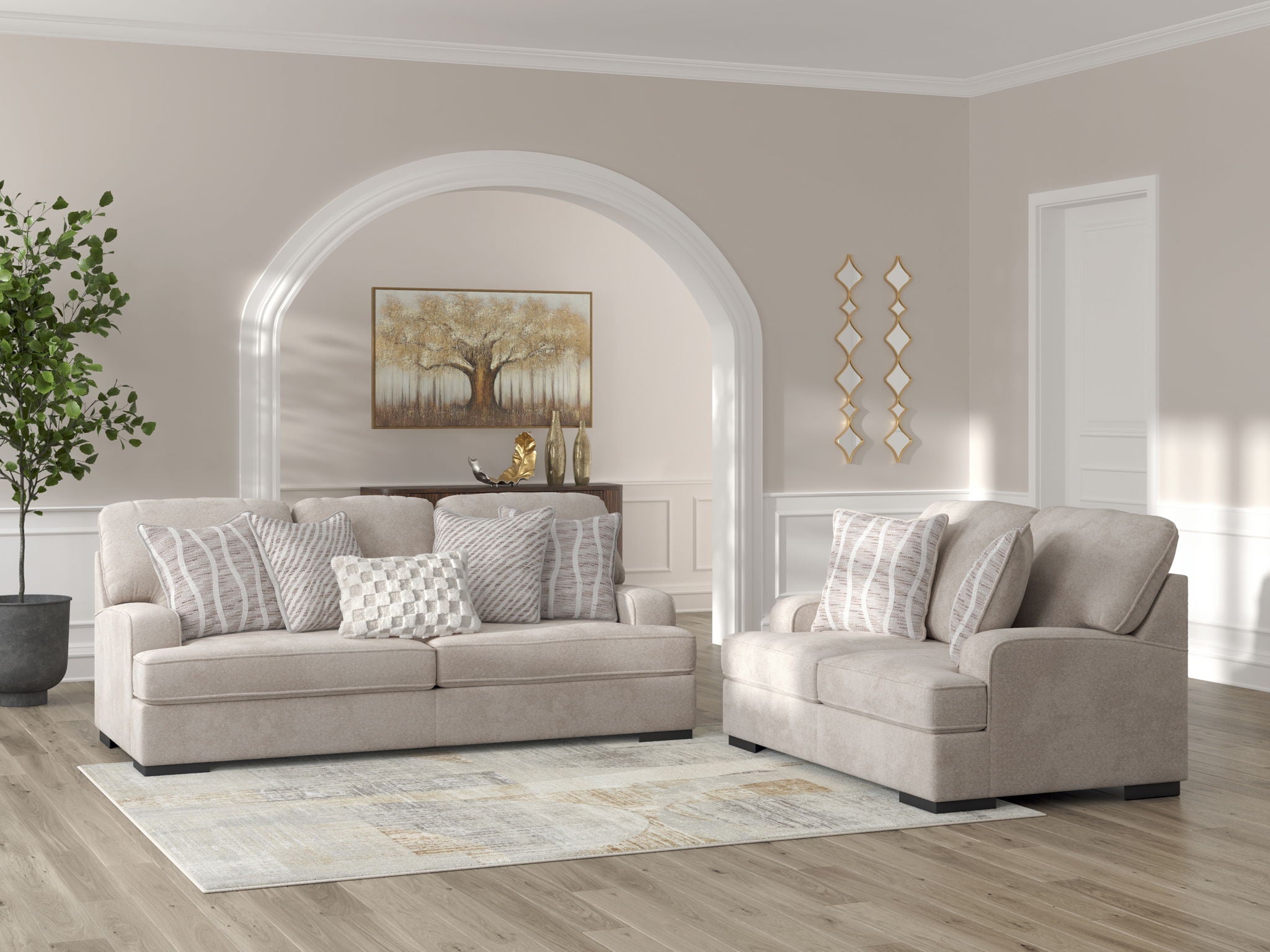 Beige sofa and chair pair with striped and checkered throw pillows