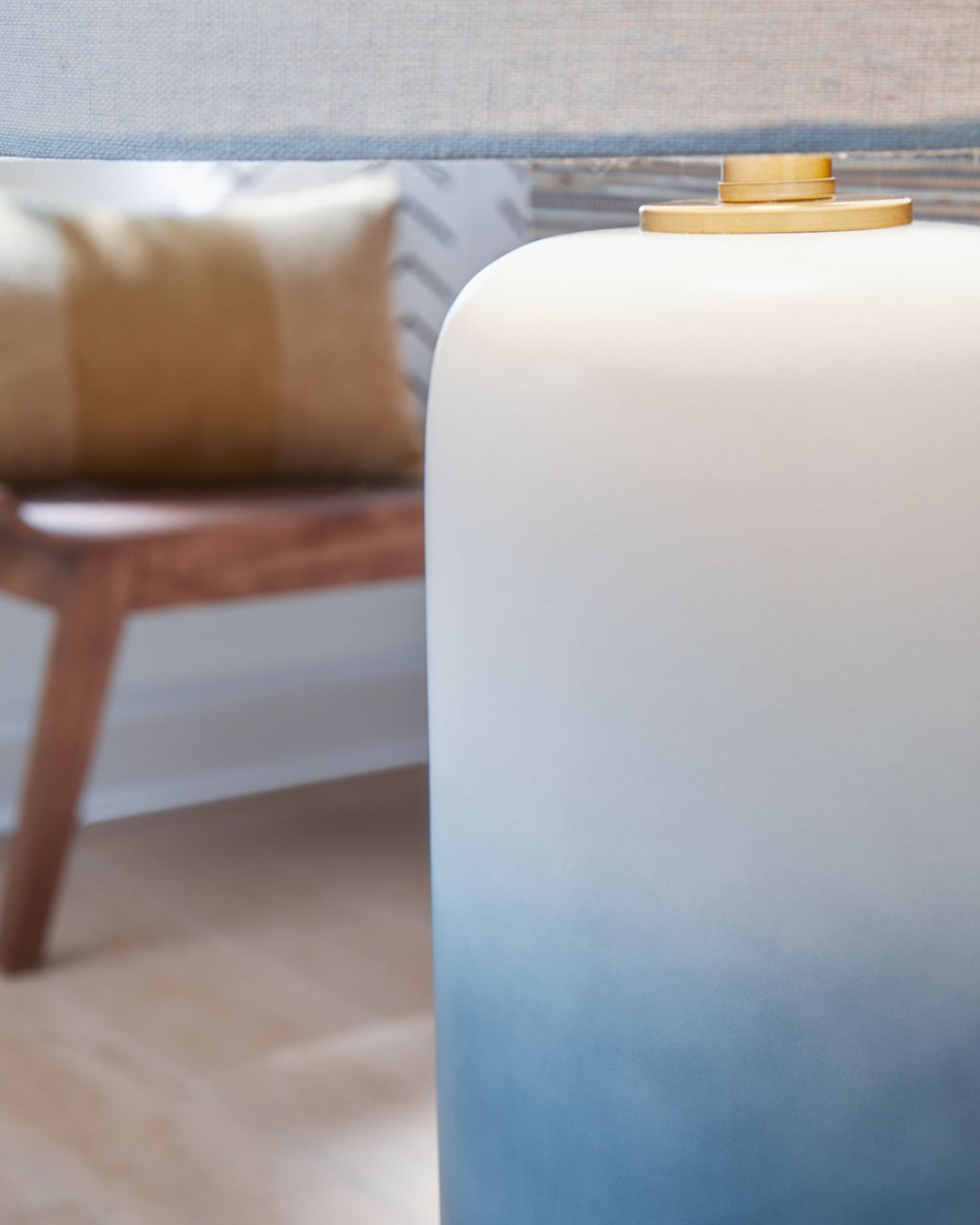 Ceramic table lamp base with gold stem and white fabric shade top