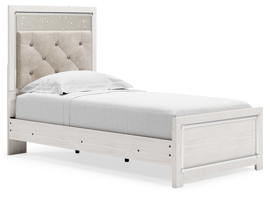White panel bed with light gray upholstered headboard and side view of footboard drawers.