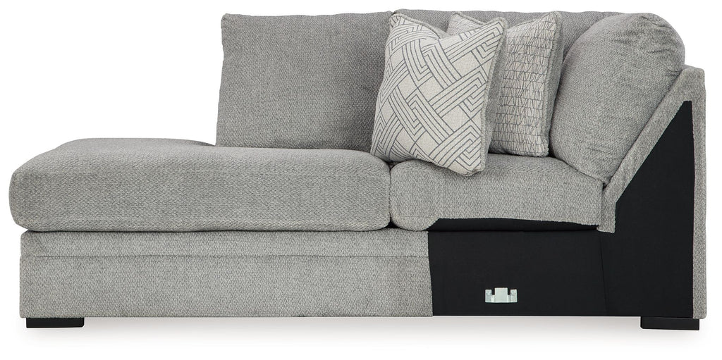 Corner chaise sofa in cement-gray fabric with geometric pillow and black base