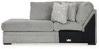 Corner chaise sofa in cement-gray fabric with geometric pillow and black base