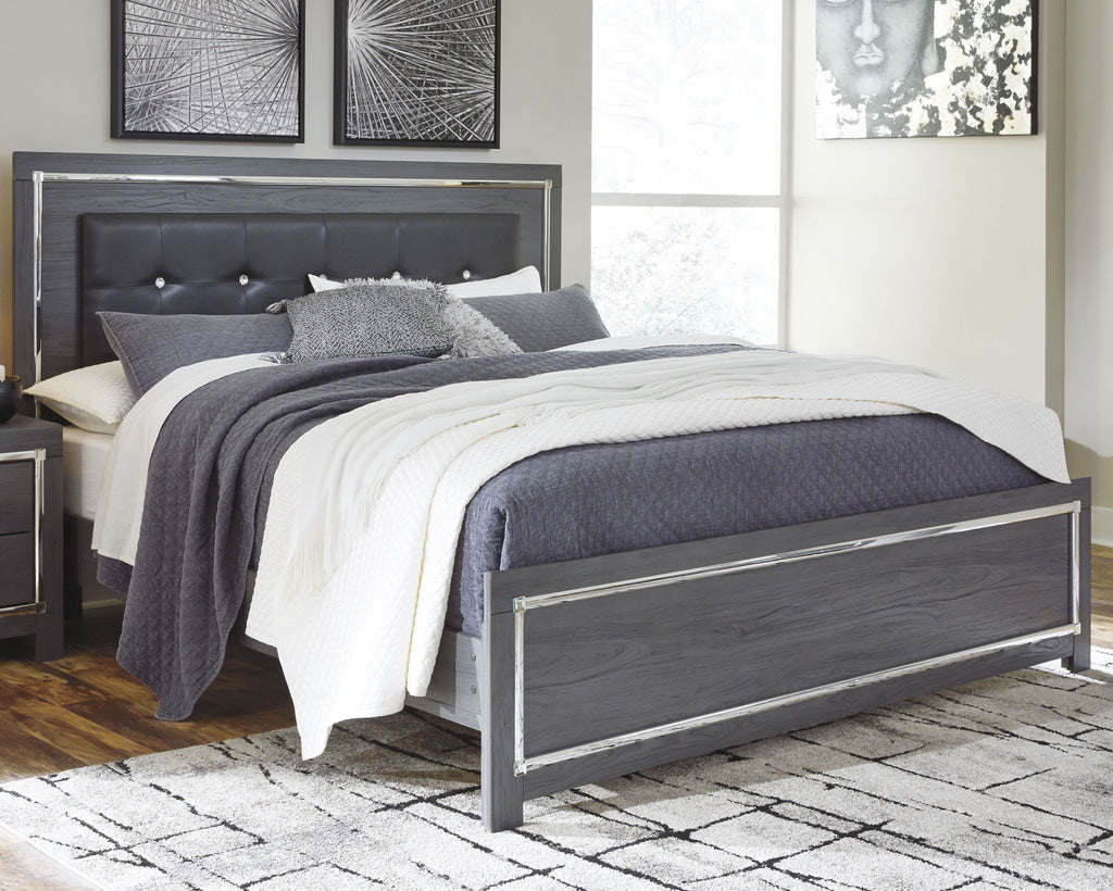 Gray panel bed with dark headboard and storage drawers, dressed with gray-and-white bedding