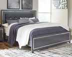 Gray panel bed with dark headboard and storage drawers, dressed with gray-and-white bedding