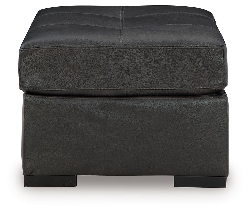 Oversized accent ottoman in dark gray with stitched seat panels and block feet