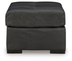 Oversized accent ottoman in dark gray with stitched seat panels and block feet
