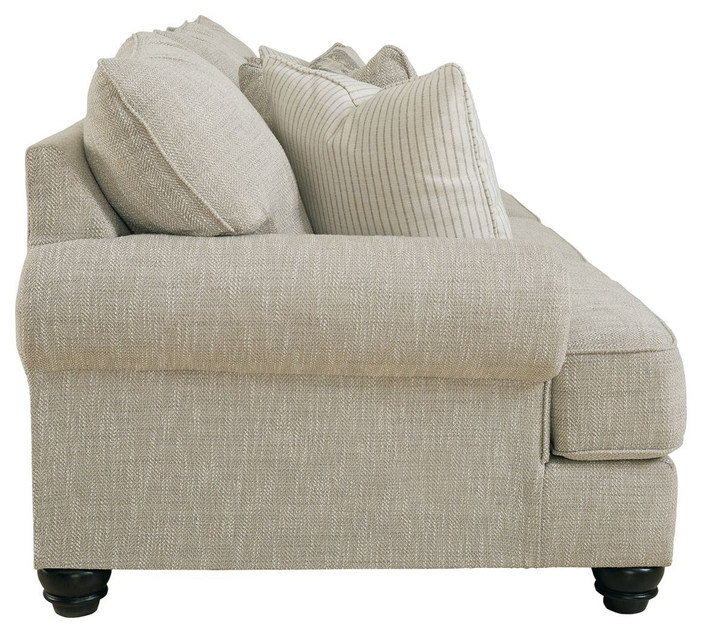 Fog sofa arm and seat with textured fabric, stacked throw pillows, dark legs