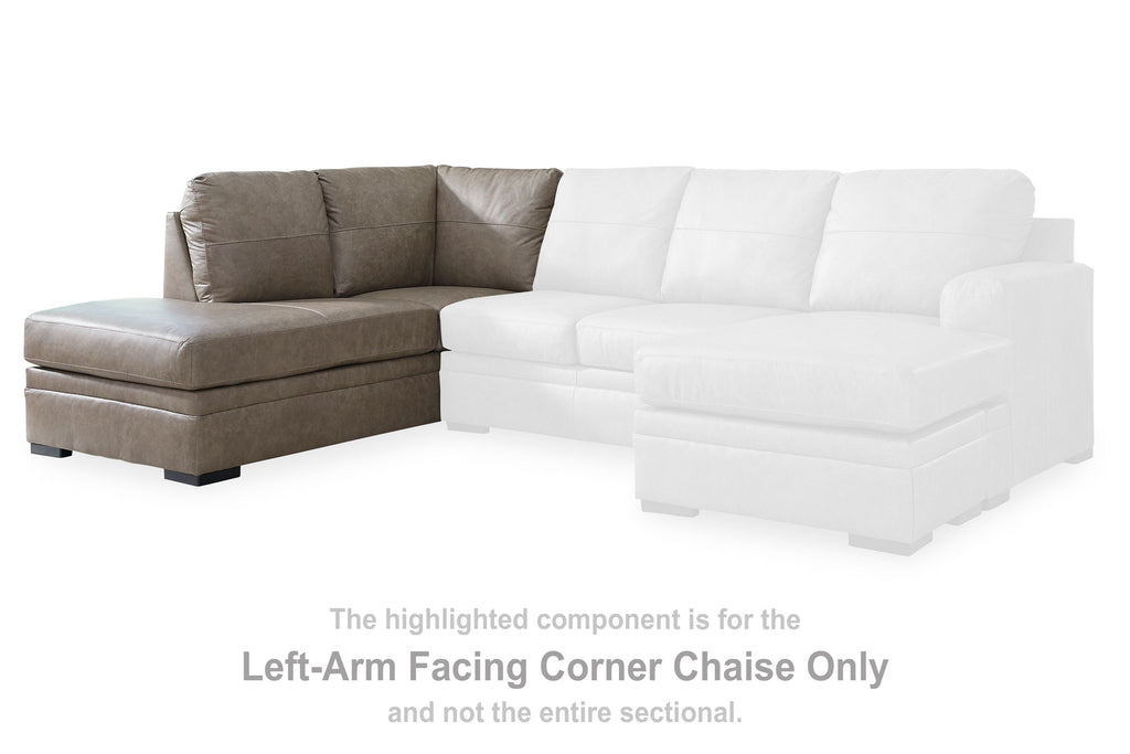 White L-shaped corner chaise with three seat sections and tufted back cushions.