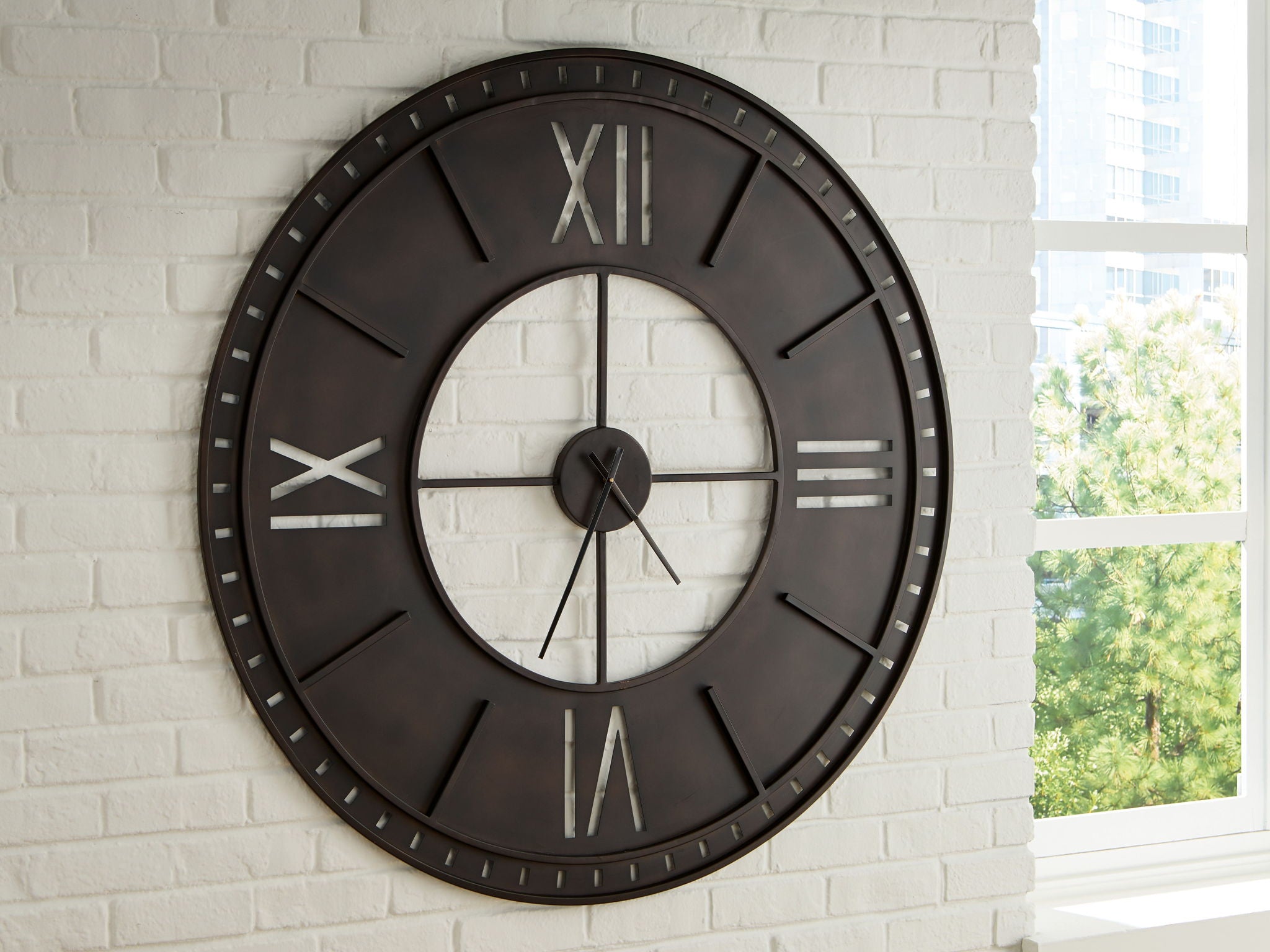Antique brown wall clock with roman numerals and black hands mounted on wall