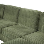 Green corduroy sectional sofa cushion close-up with stitched seams