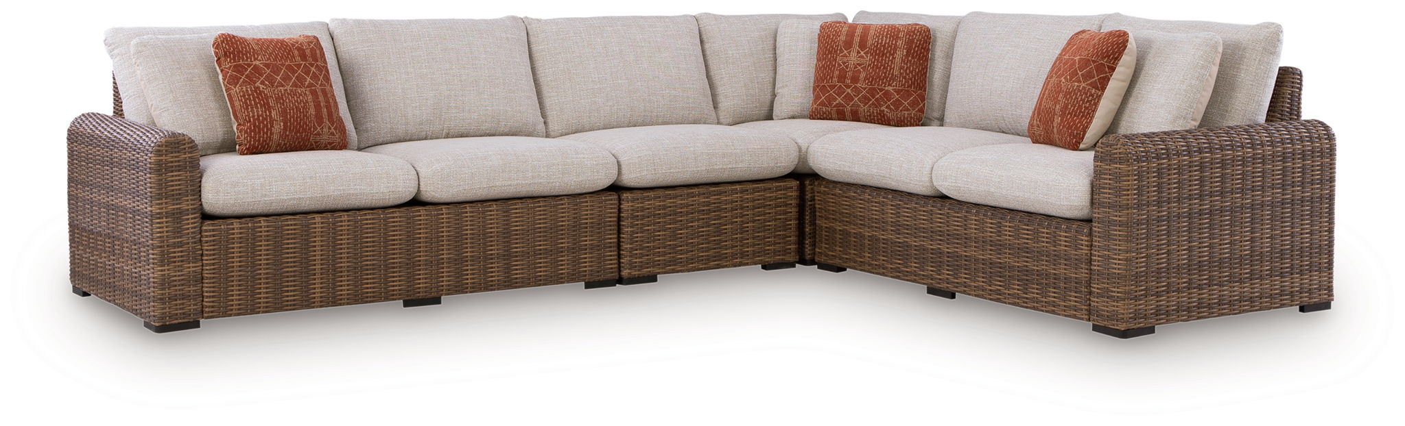 Outdoor L-shaped sectional sofa with beige seat cushions and brown wicker arms
