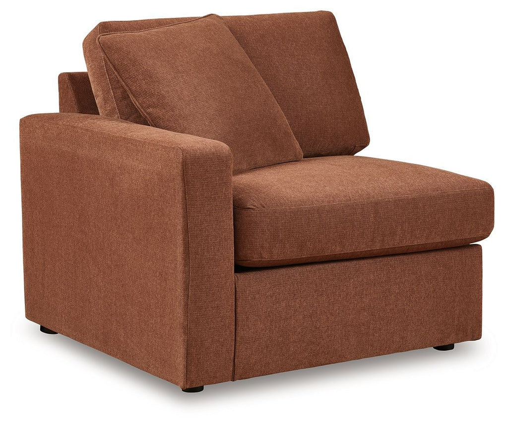 Brown fabric corner chair with two back cushions and thick padded seat cushion