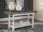 Gray flip-top sofa table with white turned legs and lower shelf, front-left angle