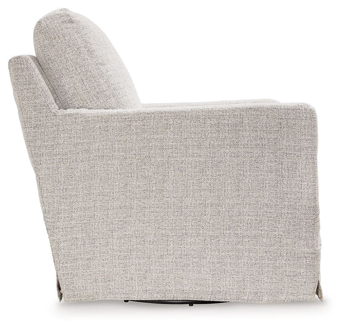 Light beige upholstered swivel glider accent chair side view with curved backrest