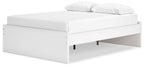 White platform bed with low upholstered frame and open storage gap