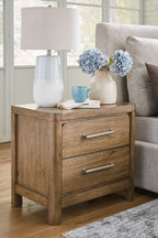 Cabalynn light brown two-drawer night stand with silver bar handles and lamp on top