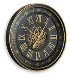 Black wall clock with gold-trim Roman numeral dial and visible gear mechanism