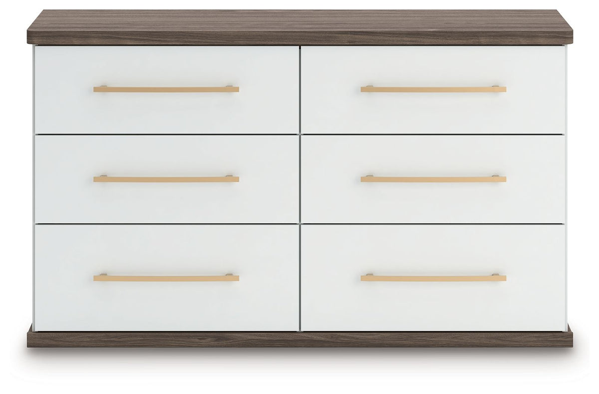 White dresser front with six drawers and gold bar pulls, flat brown top