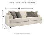Stone sleeper sofa front view with dark solid and patterned pillows