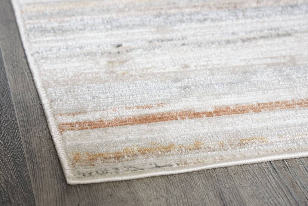 Artney rug corner close-up with light brown and gray horizontal stripes